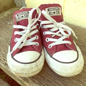 Woman’s red converse